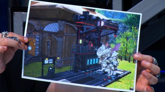FFXIV patch 6.5 Growing Light - Naoki Yoshida holds up an image of the new Garlemald structures in Island Sanctuary.